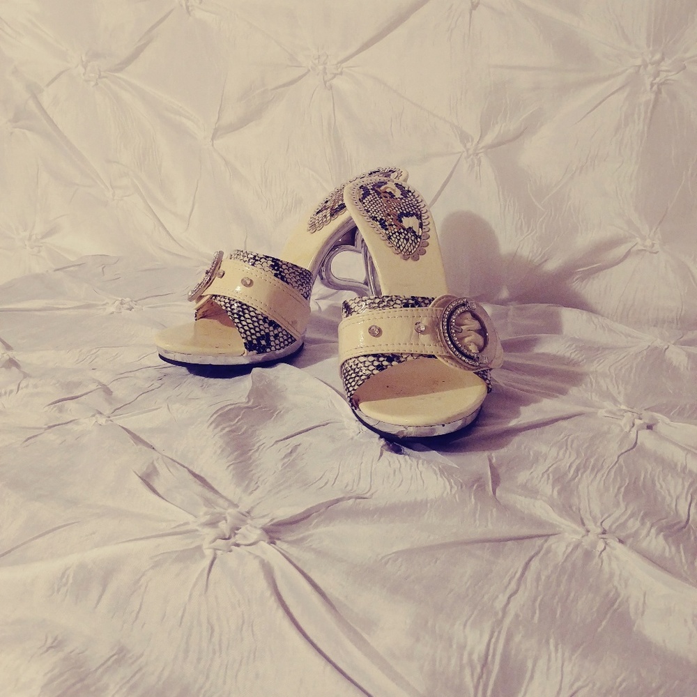 White heels with rhinestone buckle and snake detai